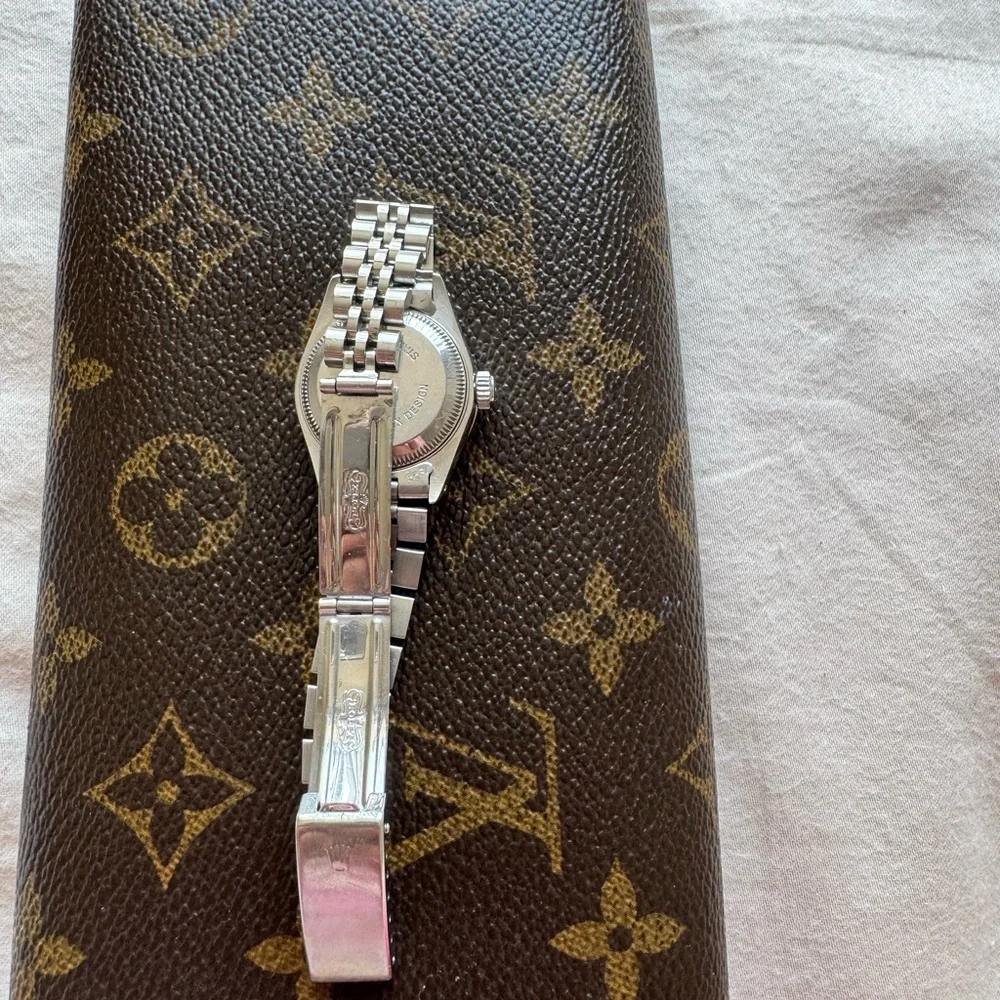 Rolex Silver Watch with White Dial and Diamond Bezel